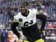  ?? MICHAEL WYKE — THE ASSOCIATED PRESS ?? Steelers running back Le’Veon Bell (26) warms up before a game last year in Houston. The veteran running back did not sign his franchise tender on Nov. 13 and will thus sit out the entire 2018 season.