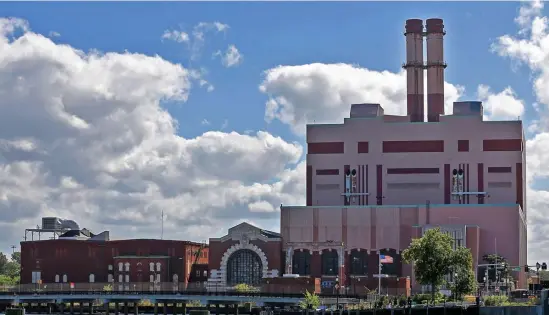  ?? MATT sTONE pHOTOs / HErALd sTAFF ?? ANOTHER ONE BITES THE DUST: The developers of the South Boston power plant will start tearing it down by the end of the year — and they promise they won’t detonate it in a rolling dust cloud the way they did at a similar site in Chicago.