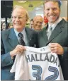  ?? CP PHOTO ?? In this Jan. 22, 2004, file photo, Toronto Blue Jays pitcher Roy Halladay, right, and Rogers Communicat­ions Inc. president and CEO Ted Rogers smile during a press conference in Toronto.