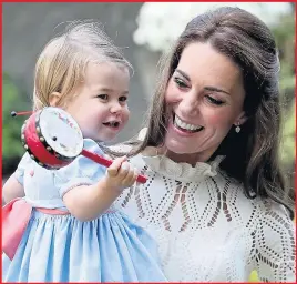  ??  ?? The Duchess holding Princess Charlotte, who will be two next month