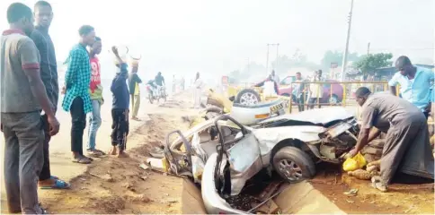  ?? Photo: Abubakar Sadiq Isah ?? The wreckage of a Honda car which killed a pedestrian and a six- year- old child on the Abuja-Lokoja road in Abaji yesterday