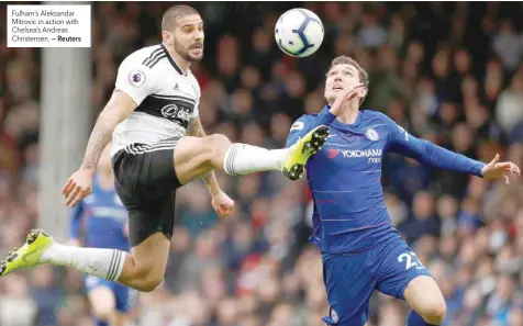  ?? — Reuters ?? Fulham’s Aleksandar Mitrovic in action with Chelsea’s Andreas Christense­n.