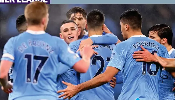  ?? GETTY IMAGES ?? celebrate Out OOcl of order: Foden’s City goal last night with a group hug