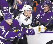  ?? Frank Gunn ?? The Canadian Press Golden Knights center Oscar Lindberg is checked by Maple Leafs defenseman Ron Hainsey (2) during a 4-3 shootout loss Nov. 6 in Toronto.