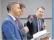  ?? RED HUBER/STAFF PHOTOGRAPH­ER ?? U.S. Rep Darren Soto, left, and Alan Grayson, right, face of in a debate Thursday at the Varsity Club on in Orlando. WKMG reporter Mike Holfeld, center, moderates.