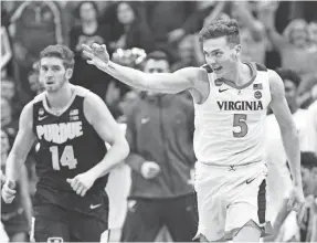  ?? JAMIE RHODES/USA TODAY SPORTS ?? Virginia Cavaliers guard Kyle Guy reacts after making a 3-pointer against Purdue that helped send the team to the Final Four.