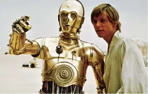  ??  ?? Mark Hamill as Luke Skywalker with C-3PO in Star Wars, 1977, above; at his Malibu home, California, in October, main