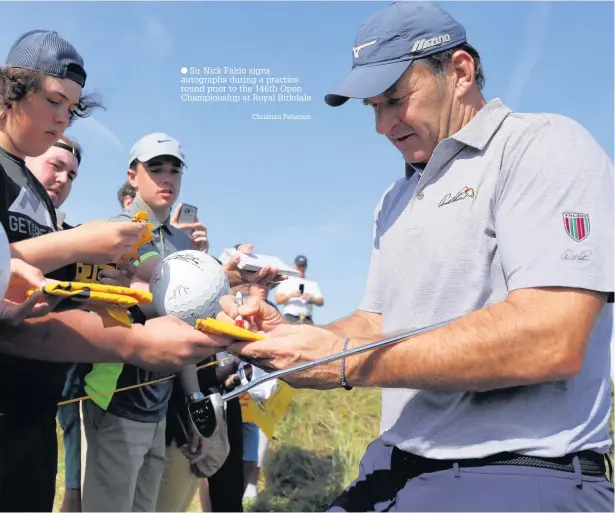  ?? Christian Petersen ?? Sir Nick Faldo signs autographs during a practice round prior to the 146th Open Championsh­ip at Royal Birkdale
