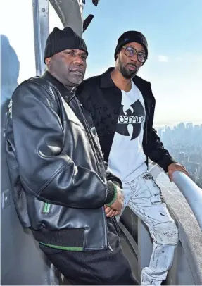  ?? ROY ROCHLIN/GETTY IMAGES ?? Masta Killa, left, and RZA of the Wu-Tang Clan visit The Empire State Building on Nov. 9 in New York City.