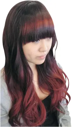  ??  ?? This dip-dye ‘shine band’ creates depth and dimension. ‘It’s definitely something that’s hot for 2013,’ says Andrea Nguyen of Ivory Noir Salon in Edmonton.