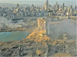  ??  ?? The explosion flattened much of the Beirut port, damaging buildings across the capital and sending a giant mushroom cloud into the sky.