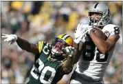  ?? JEFFREY PHELPS — THE ASSOCIATED PRESS ?? The Raiders’ Marcell Ateman makes a nice catch on a 36-yard pass in front of the Packers’ Kevin King on Sunday.