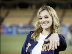  ?? ASSOCIATED PRESS ?? Daniella Rodriguez, former Miss Texas, shows off her engagement ring after Houston Astros shortstop Carlos Correa proposed after Game 7 of baseball’s World Series Wednesday in Los Angeles. The Astros won 5-1 to win the series 4-3 against the Los...