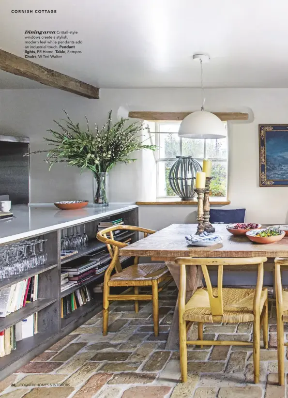  ??  ?? Dining area Crittall-style windows create a stylish, modern feel while pendants add an industrial touch. Pendant lights, PR Home. Table, Sempre. Chairs, W Teri Walter