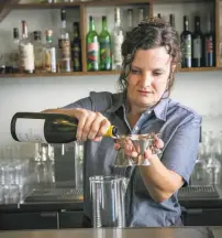  ?? John Storey / Special to The Chronicle 2014 ?? Jennifer Colliau makes a martini at the Interval in S.F., one of the bars she’s led in recent years.