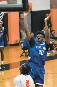  ?? ?? Mount Carmel’s Tyson Heflin scores against McDonogh in the first half Friday.