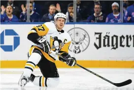  ?? FRANK FRANKLIN II / ASSOCIATED PRESS ?? Pittsburgh Penguins’ Sidney Crosby reacts after getting knocked down during the first period of Game 5 of a first-round playoff series against the New York Rangers on Wednesday in New York. The Rangers won, 5-3.