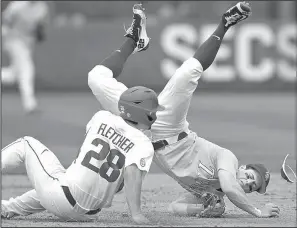  ?? NWA Democrat-Gazette/BEN GOFF ?? Arkansas center fielder Dominic Fletcher (left) collides with LSU second baseman Cole Freeman after sliding into the base during the fourth inning of Sunday’s SEC Tournament championsh­ip game. Some LSU players took exception to the slide, but umpires...