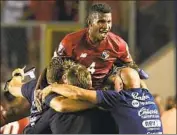  ?? Rogelio Figueroa AFP/Getty Images ?? MEMBERS of Panama’s team celebrate after scoring in a Sept. 8 qualifier against Mexico in Panama City.