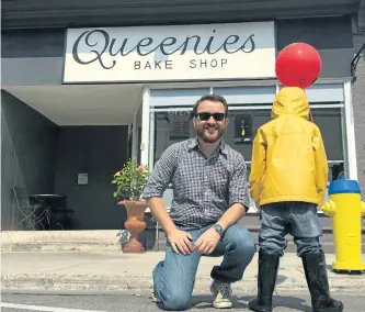  ?? PETE FISHER/POSTMEDIA NETWORK ?? Adam Pearson from Queenies Bake Shop on Walton Street in Port Hope with a character from the upcoming It movie. The Bake Shop is having a party on Friday celebratin­g the movie that was partially filmed in Port Hope last summer.