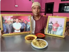  ?? — Bernama photo ?? Hassan showing the photo of the Yang Di-Pertuan Agong, Sultan Ibrahim Sultan Iskandar, at His Majesty’s favourite dish roti canai.