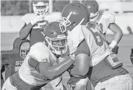  ?? Michael Ciaglo / Houston Chronicle ?? University of Houston defensive tackle Ed Oliver, left, the Cougars’ most touted recruit from the offseason, has coaches and players excited for what’s to come.