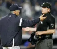  ?? KATHEY WILLENS - THE ASSOCIATED PRESS ?? New York Yankees manager Joe Girardi, left, argues the last call with home plate umpire Dan Bellino during the ninth inning at the end of the Yankees’ 6-2 loss to the Kansas City Royals.