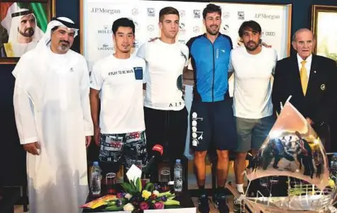  ?? Clint Egbert/Gulf News ?? From left: Salah Tahlak, Dubai Duty Free Tennis Championsh­ips tournament director with players Yuichi Sugita, Borna Coric, Robin Haase, Marcos Baghdatis and Colm McLoughlin, executive vice-chairman and CEO of DDF, at the men’s draw yesterday.