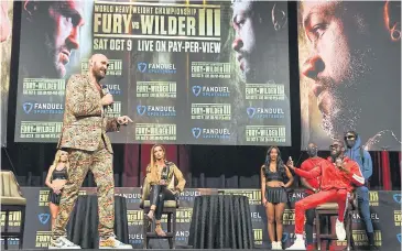  ?? AFP ?? Tyson Fury, left, and Deontay Wilder, second right, attend a press conference in Las Vegas on Wednesday.