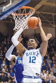  ?? AP/BEN MCKEOWN ?? Duke’s Javin DeLaurier (12) goes up for a shot during the team’s game against Georgia State in Durham, N.C., on Friday.