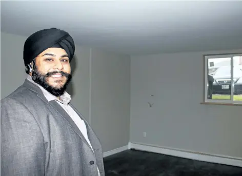  ?? ALLAN BENNER/STANDARD STAFF ?? Manny Bedi said his company has invested hundreds of thousands of dollars in a complete renovation of a St. Catharines apartment building, hoping to rejuvenate the neighbourh­ood in the process, on Friday.