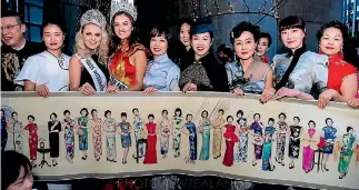  ?? PHOTO: SUPPLIED ?? Women in Chinese cheongsam dresses were in the flash mob in Auckland for the revealing of the scroll.