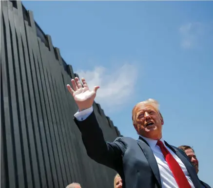  ?? PHOTO: REUTERS/CARLOS BARRIA ?? Photo ops: US President Donald Trump waves as he tours a section of new US-Mexico border wall in San Luis, Arizona.