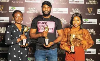  ?? ?? L-R: Assistant Brand Manager, Guinness, Odinakachi Njoku; Brand Manager, Guinness Smooth, Deji Layade; & Brand Manager, Guinness, Cynthia Ufele, all of Guinness Nigeria PLC, receiving the awards in the Experienti­al Marketing campaign of the year, Campaign of the Year & Legacy Brand of the Year Categories at the 2022 ADVAN African Awards for Marketing Excellence, recently in Lagos...recently