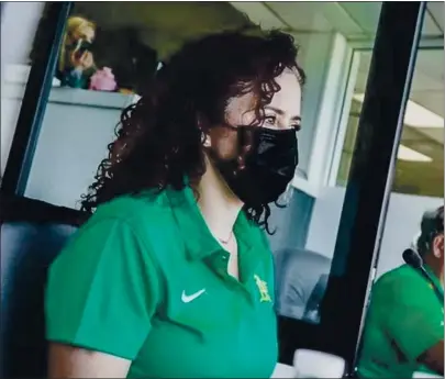  ?? COURTESY OF THE ATHLETICS ?? Amelia Schimmel, the new PA announcer for the Oakland Athletics, works a spring game at Hohokam Stadium in Mesa, Arizona.