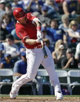  ?? ELAINE THOMPSON — THE ASSOCIATED PRESS ?? Angels’ Mike Trout connects on a three-run home run against the Cubs in the third inning of a spring training game March 5, in Tempe, Ariz.