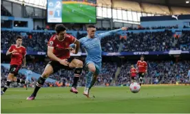 ?? ?? Manchester United’s Harry Maguire and Manchester City’s Phil Foden battle for the ball at the Etihad Stadium in March. Photograph: Tom Jenkins/The Guardian