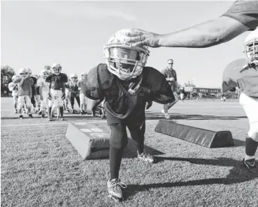  ?? H. DARR BEISER, USA TODAY SPORTS ?? Michael Tillery, 8, does a Heads Up Football drill run by USA Football in Fairfax County, Virginia.