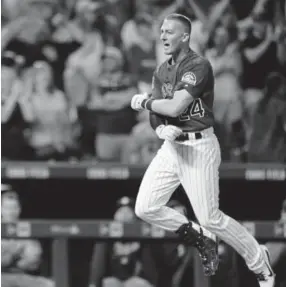  ?? Joe Mahoney, Getty Images ?? Rockies rookie Ryan McMahon celebrates hitting a walk-off, three-run homer to beat the Los Angeles Dodgers last week at Coors Field.