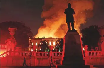  ?? Reuters ?? Firefighte­rs try to extinguish a fire at the National Museum of Brazil in Rio de Janeiro on Sunday.