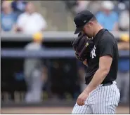  ?? CHARLIE NEIBERGALL — THE ASSOCIATED PRESS ?? Yankees starting pitcher Carlos Rodon walks off the field after being taken out of the game in the fourth inning of a spring training game against the Rays Wednesday in Tampa, Fla.