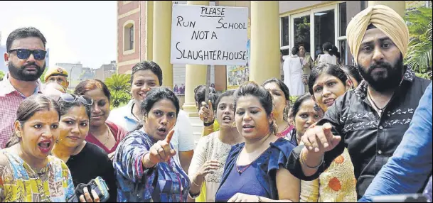  ?? HT FILE ?? Parents gather outside Ryan Internatio­nal School at Mayur Vihar Phase III after the brutal murder of a student of Ryan Gurgaon.