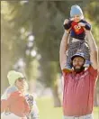  ?? Cliff Hawkins / Getty Images ?? Jon Rahm celebrates with his wife, Kelley, and their two sons after winning the Genesis Invitation­al Sunday.