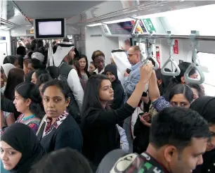  ?? —File photo ?? Commuters travel on Dubai Metro during last year’s Car-Free Day. This year, the Dubai Municipali­ty will donate a sum of money to charity and planting trees for every car that’s left at home.