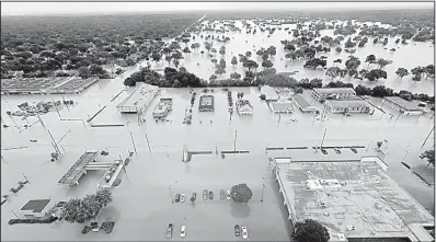  ?? AP/DAVID J. PHILLIP ?? Water from Addicks Reservoir flows into neighborho­ods as floodwater­s from Tropical Storm Harvey rise in Houston late last month.