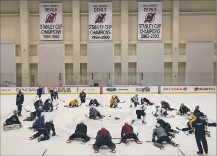  ?? Robert Gauthier Los Angeles Times ?? THE DEVILS DISPLAY THEIR THREE Stanley Cup banners at the Prudential Center, but that didn’t intimidate the Kings, who are 9-0 on the road in the postseason and get some practice in on their second consecutiv­e day off in New Jersey.