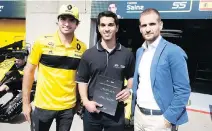  ??  ?? From left to right: Carlos Sainz, Renault Sport Formula One driver; Chase Pelletier, UOIT student and this year’s IEA Canada winner; and Tomasso Volpe, Infiniti’s global motorsport director.