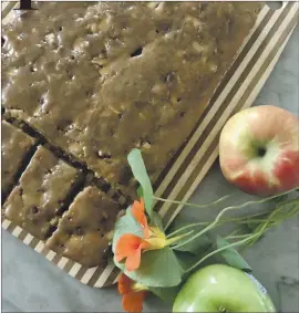  ?? PHOTO BY CATHY THOMAS ?? Apple cake bars with a little whipped cream can work as a dessert, or by themselves for breakfast.