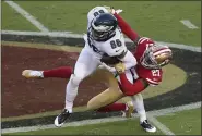  ?? JED JACOBSOHN — THE ASSOCIATED PRESS ?? Philadelph­ia Eagles tight end Zach Ertz (86) is grabbed by San Francisco 49ers cornerback Dontae Johnson (27) during the first half of an NFL football game in Santa Clara, Calif., Sunday, Oct. 4, 2020.