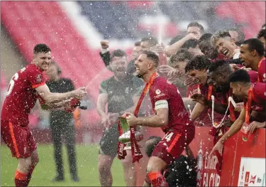  ?? AP ?? Liverpool players celebrate at the end of the English FA Cup final against Chelsea at Wembley Stadium in London on Saturday.